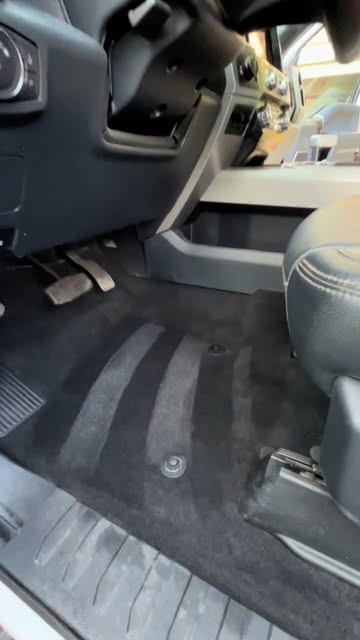 Dark interior floor mat with vacuum lines from Jetty Forge’s Instagram